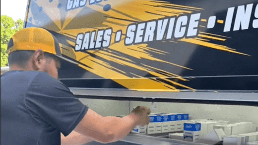Five Star employee working on truck